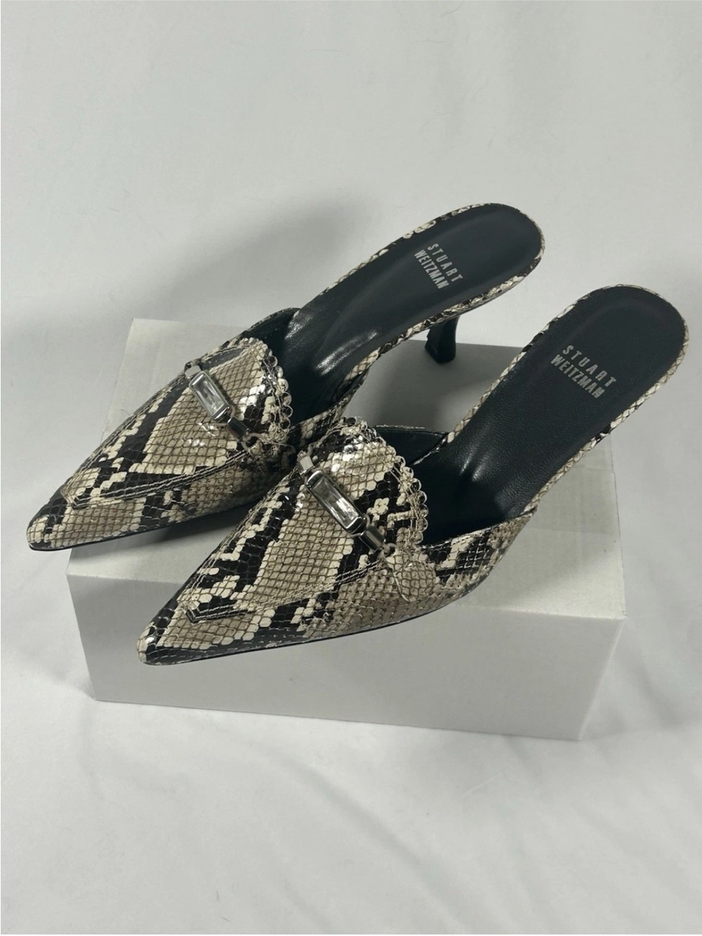 Stuart Weitzman Black and Cream Snakeskin Pointed Toe Mules with Accent Buckle